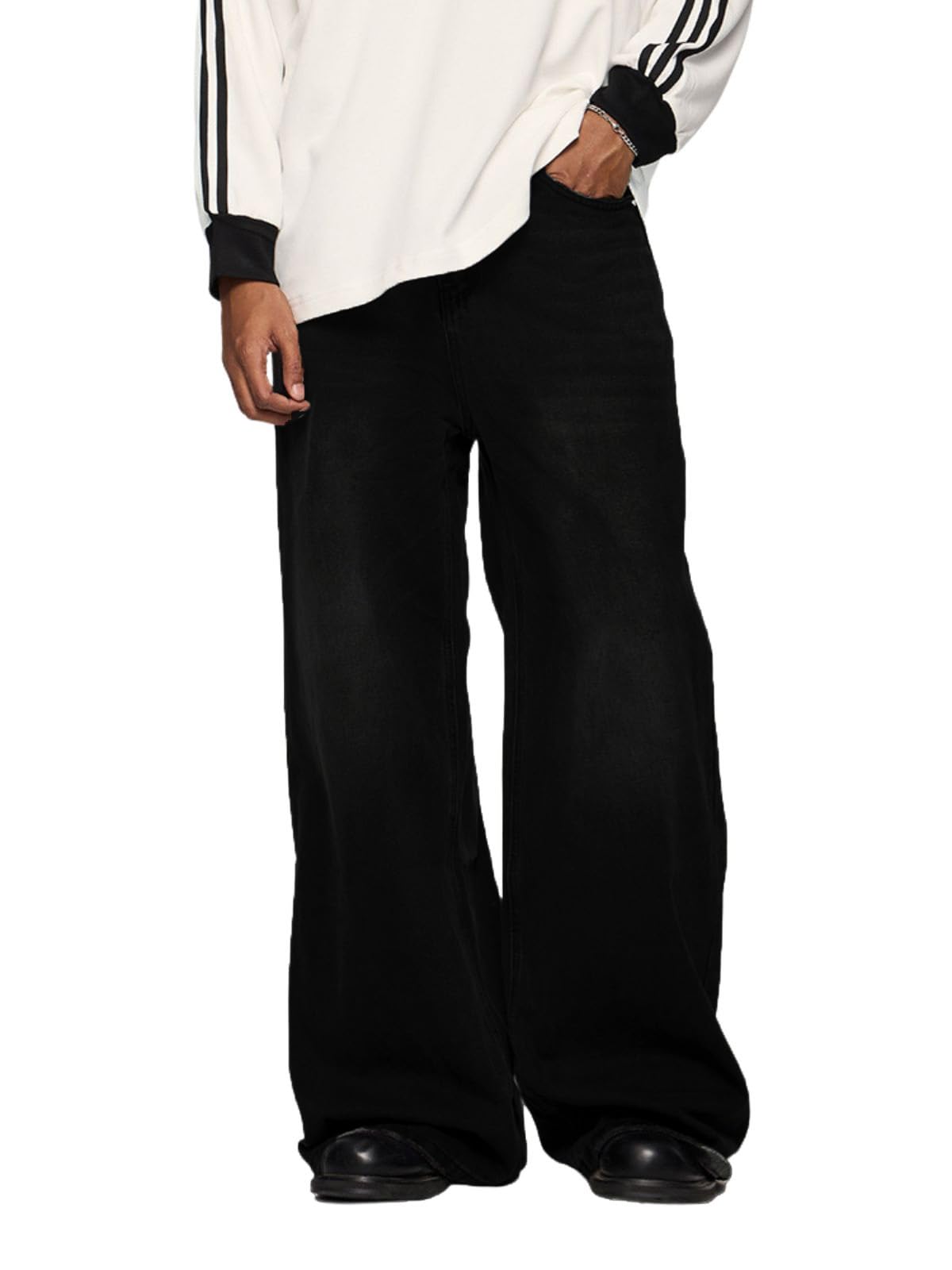 Person wearing a white jacket with black stripes and black wide-leg pants on a white background