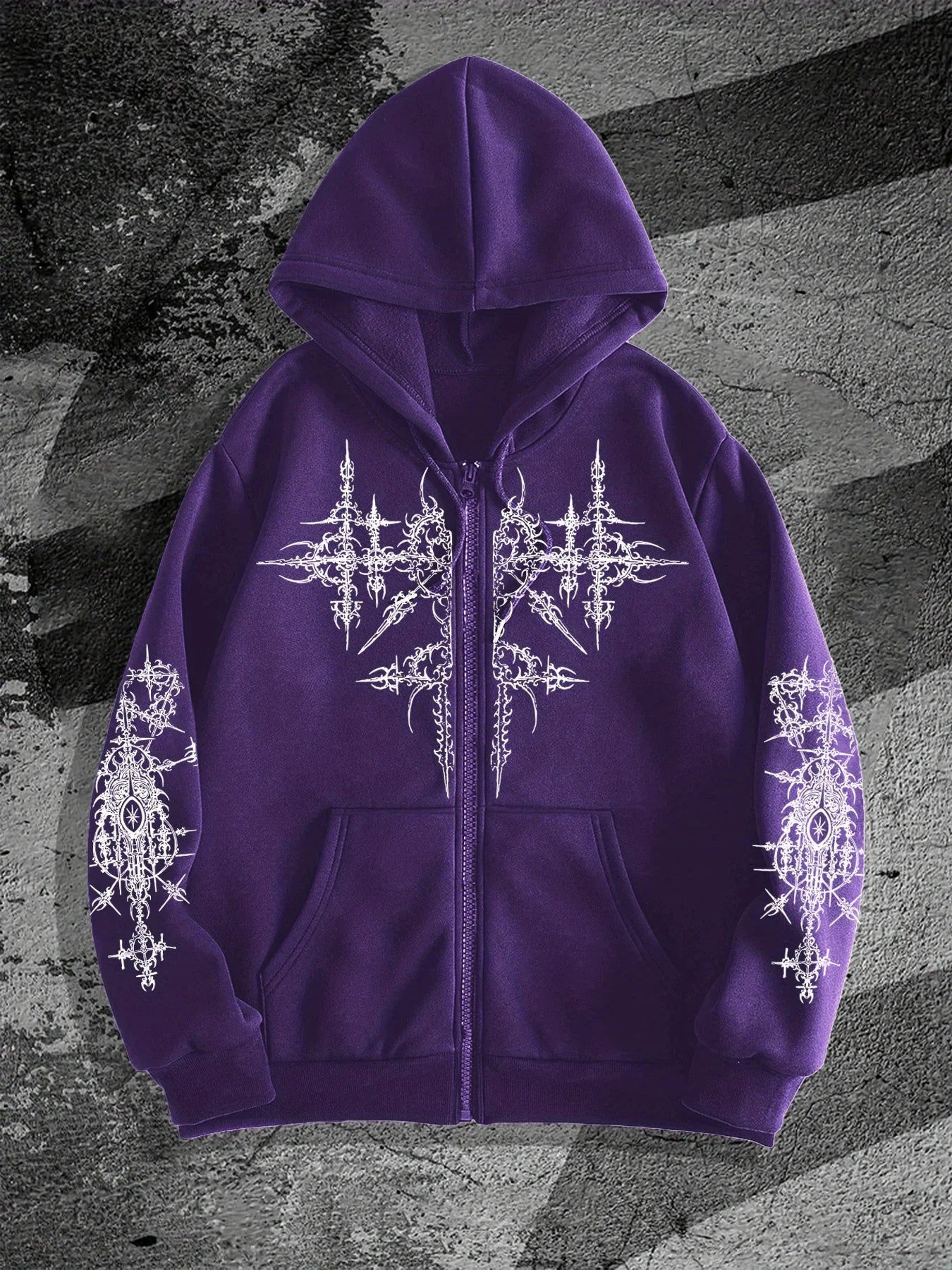 Purple hoodie with white intricate designs on a textured gray background